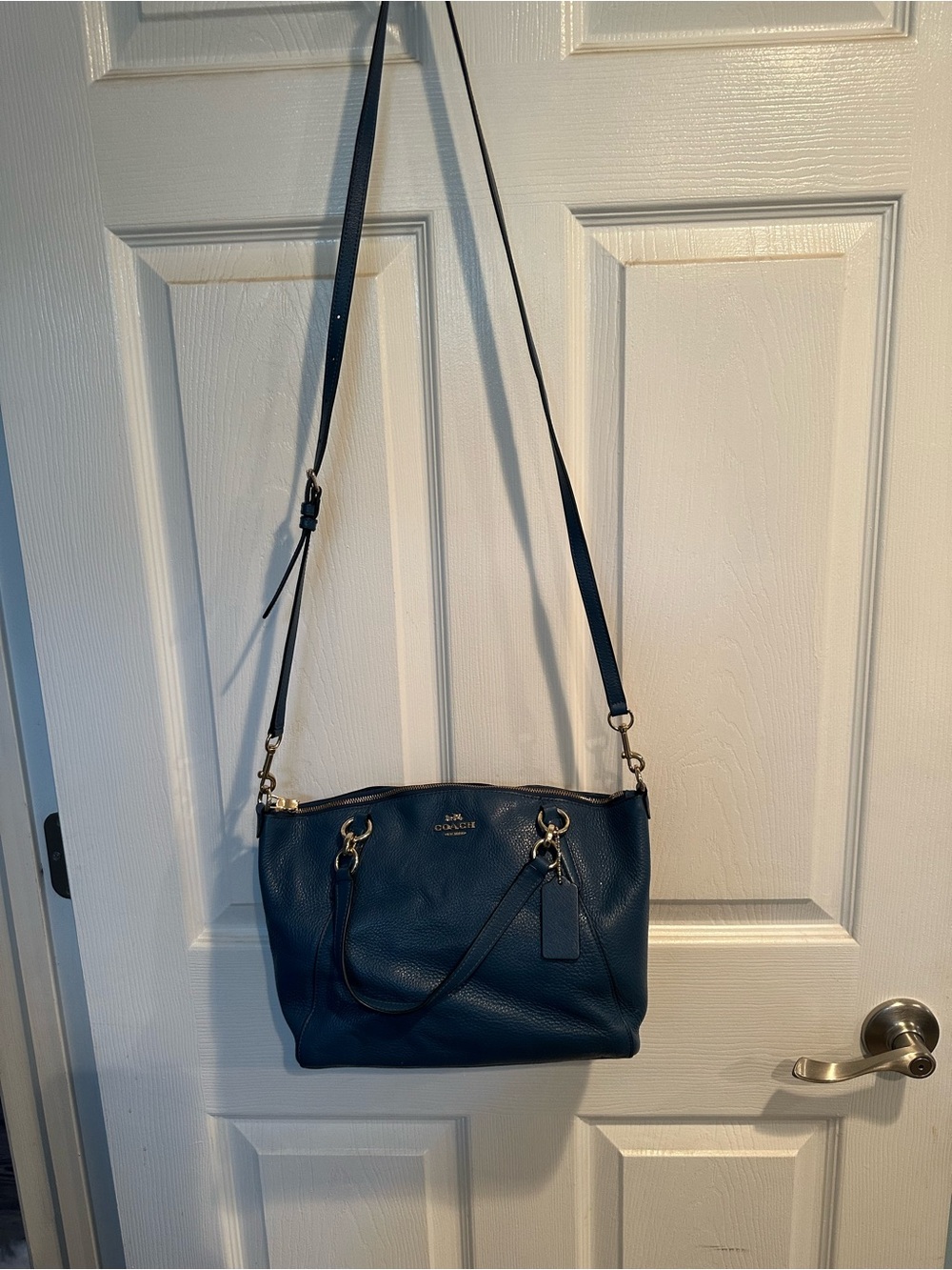 Coach Dark Teal Pebbled Leather Crossbody Shoulder Bag with matching wallet.